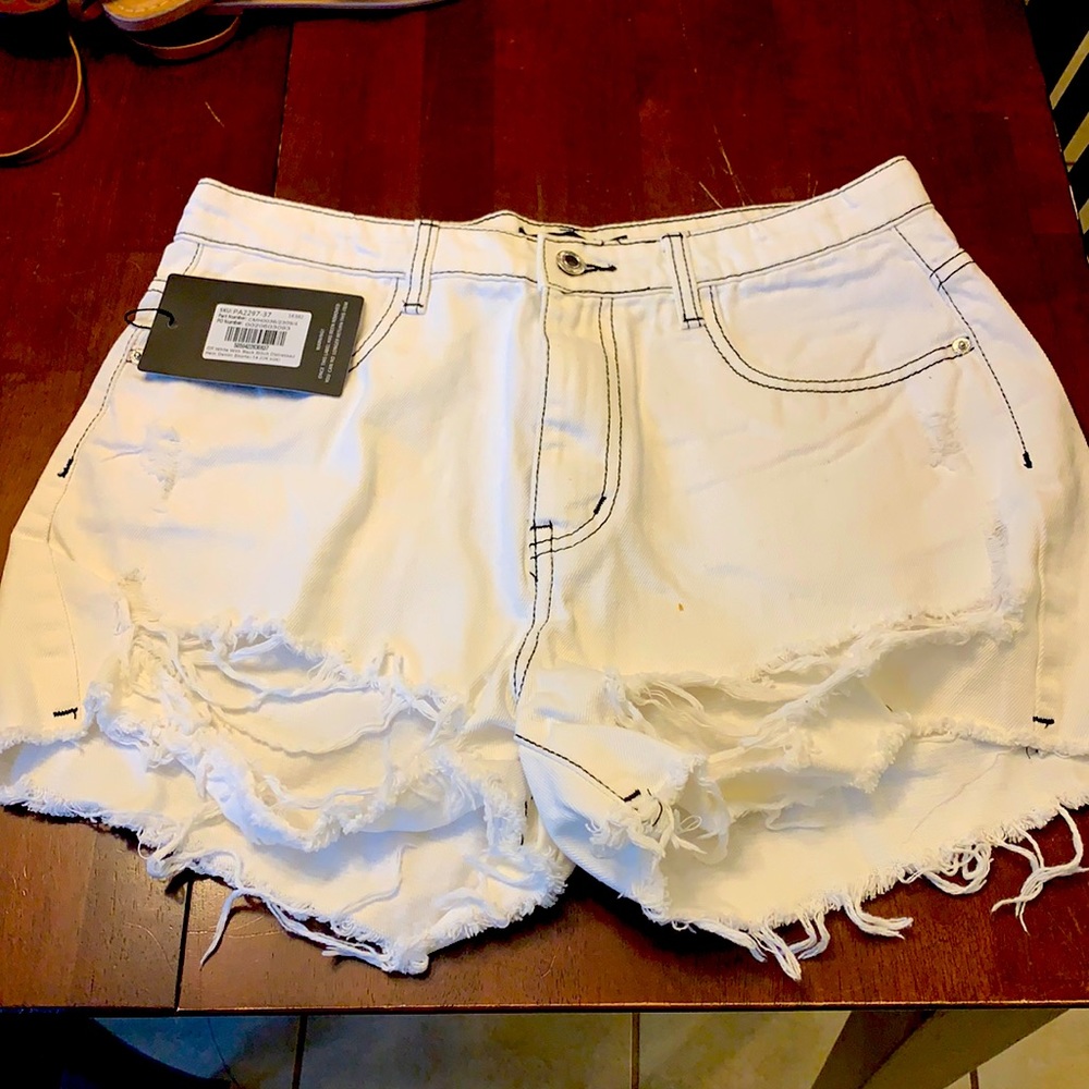 Pretty Little Thing white distressed shorts